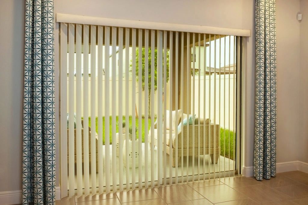 Vertical blinds across a sliding glass door